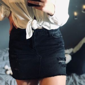 Black distressed mini skirt